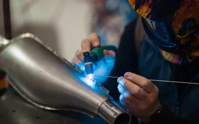 man-fixing-motorcycle-modern-workshop_158595-8137